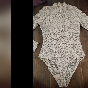 Lace tan color bodysuit with long sleeves size large , beautiful details on back
